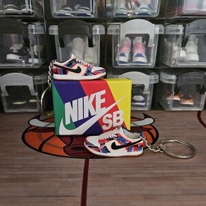 Nike SB pair of mini sneakers keychain.